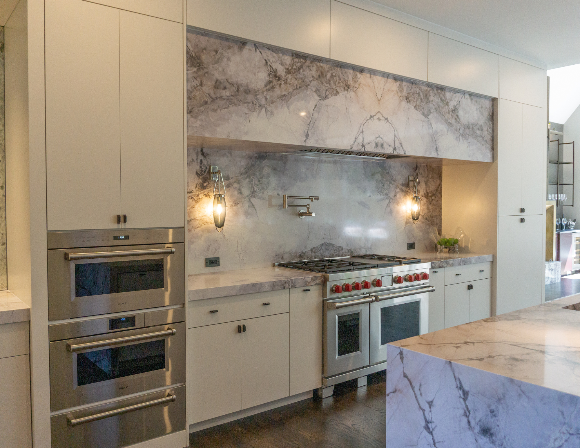 Custom kitchen renovation with wolf appliance, custom waterfall kitchen island with quartz countertop in Suwanee, GA