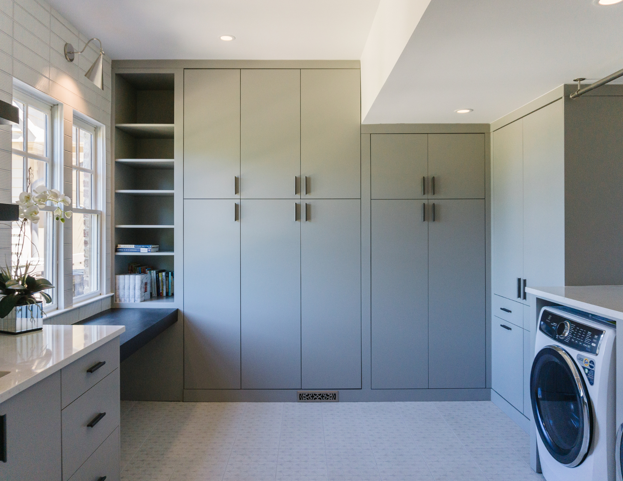 Custom laundry room with custom cabinetry, wash station. Laundry room expansion in Suwanee, GA